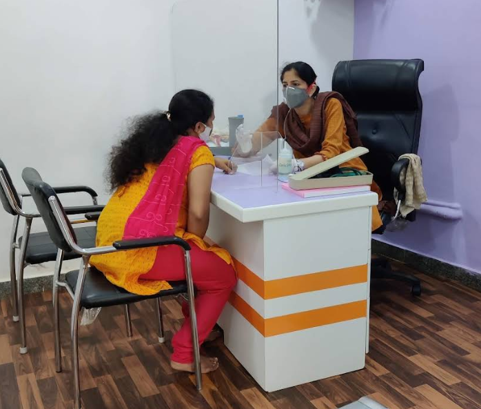 Dr. Sunita Sharma consulting with patient at Women's Care Clinic